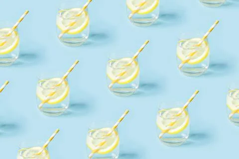 Yellow summer pattern with glasses of lemonade. Stock Photos