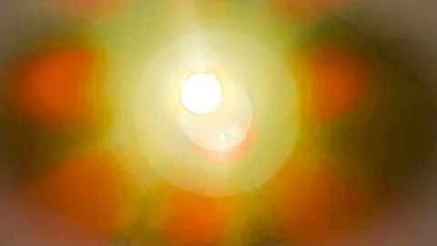 A yellow sun is shining through a window, casting a warm glow on the room Stock Photos