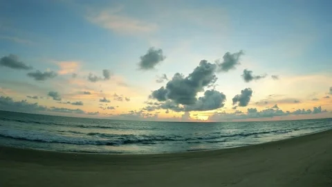 Yellow sunset cloud over sea water n ocean wave on cyan blue sky Video stock 160644380