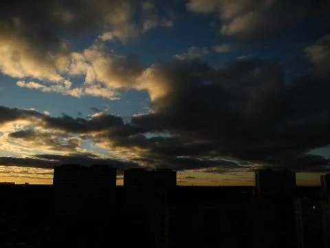 Yellow sunset with clouds Stock Photos