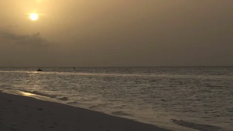 Yellow sunset over ocean from beach Video stock 74088524