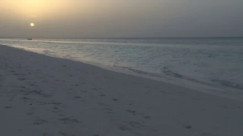 Yellow sunset over ocean from beach Video stock 74088533