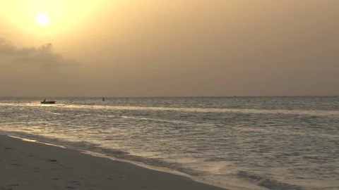 Yellow sunset over ocean from beach Video stock 74088557