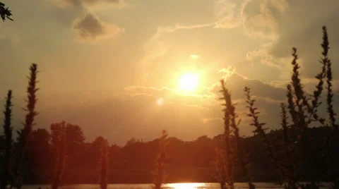 Yellow Sunset on a pond (HD) Stock Footage 28502638