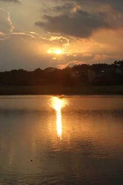 Yellow Sunset on a pond Foto stock