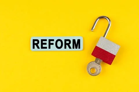 On a yellow surface, an open lock with the image of the flag of Poland with a Stock Photos