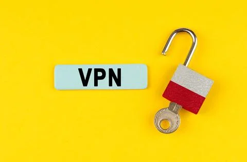 On a yellow surface, an open lock with the image of the flag of Poland with a Stock Photos