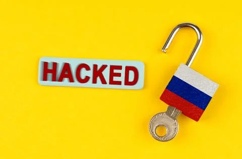 On the yellow surface is an open lock with a key and a sticker with the ins.. Stock Photos