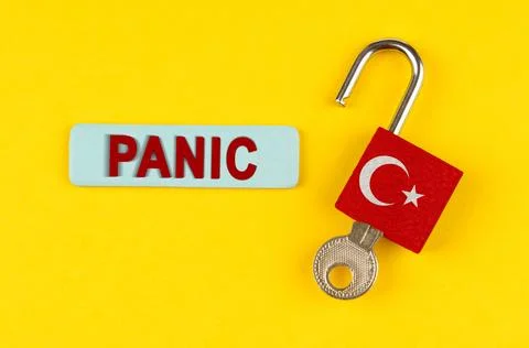 On the yellow surface is an open lock with a key and a sticker with the ins.. Foto stock