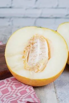 Yellow sweet melon on the table Stock Photos