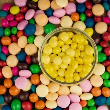 Yellow sweets in jar Stock Photos