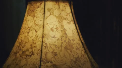 Yellow table lamp shade in darkness Stock Footage 162912110