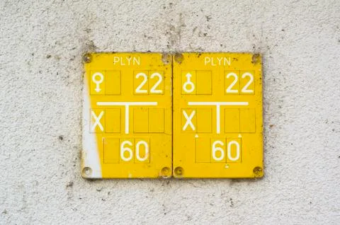 Yellow table on the wall. Czech text Plyn (Gas) is on the sign. Stock Photos