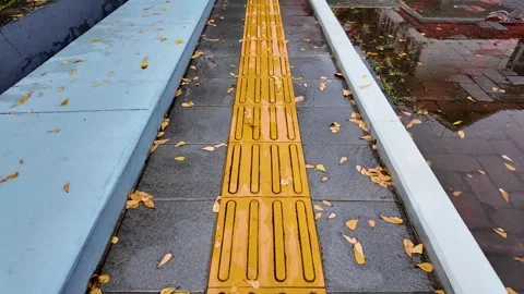 Yellow Tactile Paving Blocks for Blind People Stock Footage 335189847