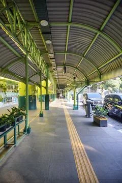 Yellow tactile paving guide path facility on the departure corridor outside Stock Photos