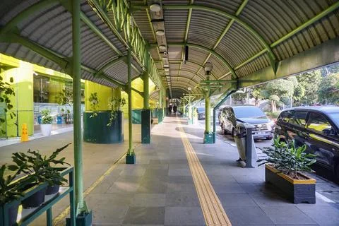 Yellow tactile paving guide path facility on the departure corridor outside Stock Photos