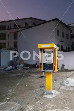 Yellow telephone booth in Muscat, Oman Stock Photos