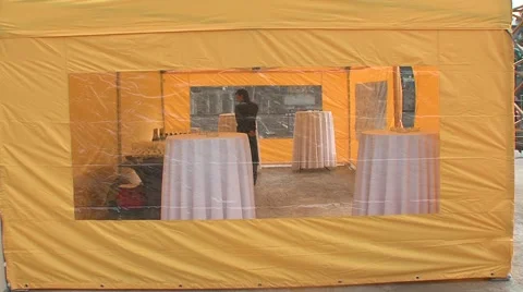 Yellow tent bar tables Stock Footage 5165062