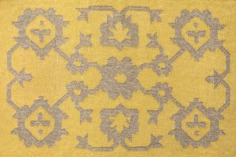 Yellow textile with abstract ethnic pattern. Boho style folk fabric, rug Foto stock