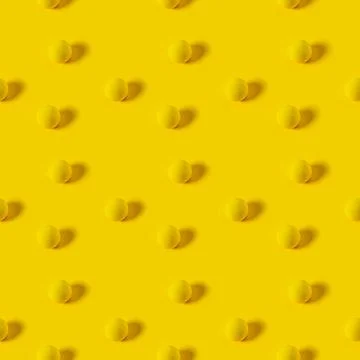 Yellow texture balls on a yellow background. seamless pattern. Stock Photos
