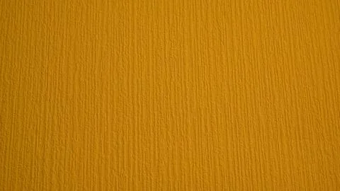 Yellow texture. Waves on a yellow background. Stock Photos