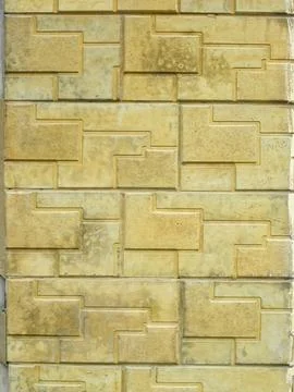 Yellow textured tiles on the cladding of the house. Vertical building background Stock Illustration