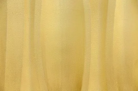 Yellow textured wavey wall background Stock Photos