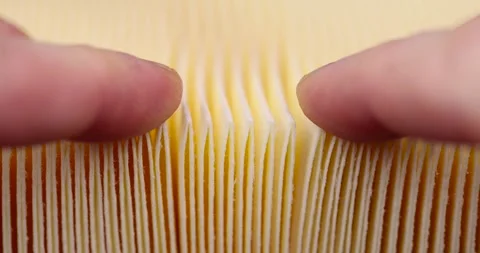 Yellow thin car filter for air filtration, new clean car filter to ensure engine Stock Footage 260723248