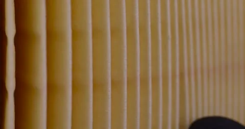 Yellow thin car filter for air filtration, new clean car filter to ensure engine Stock Footage 261681977