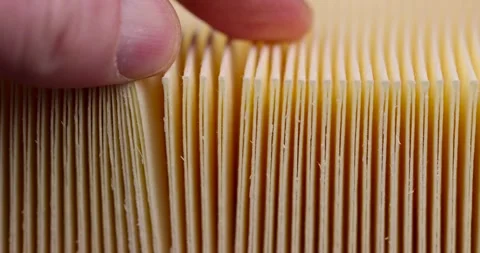 Yellow thin car filter for air filtration, new clean car filter to ensure engine Stock Footage 262611199