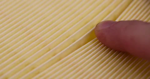 Yellow thin car filter for air filtration, new clean car filter to ensure engine Stock Footage 263104979