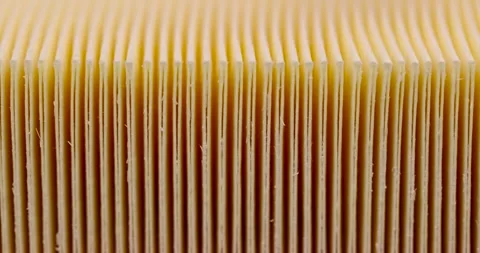 Yellow thin car filter for air filtration, new clean car filter to ensure engine Stock Footage 263607621