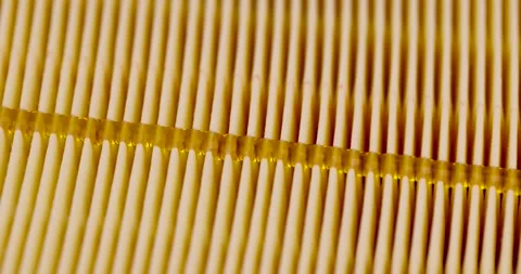 Yellow thin car filter for air filtration, new clean car filter to ensure engine Stock Footage 264853034