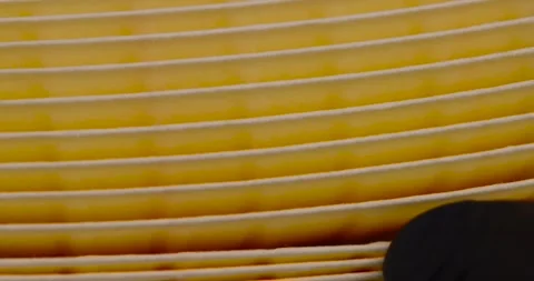 Yellow thin car filter for air filtration, new clean car filter to ensure engine Stock Footage 265546394