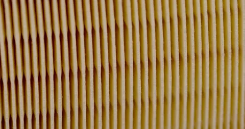 Yellow thin car filter for air filtration, new clean car filter to ensure engine Stock Footage 265830441