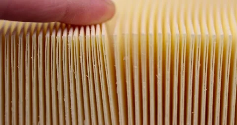 Yellow thin car filter for air filtration, new clean car filter to ensure engine Stock Footage 266672702