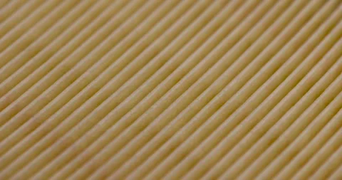 Yellow thin car filter for air filtration, new clean car filter to ensure engine Stock Footage 267183966