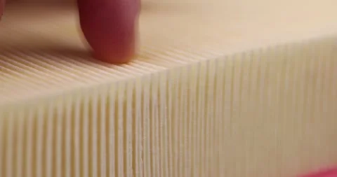 Yellow thin car filter for air filtration, new clean car filter to ensure engine Stock Footage 268946261