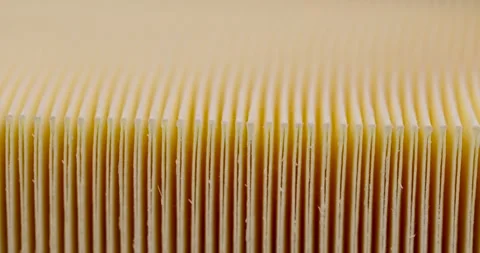 Yellow thin car filter for air filtration, new clean car filter to ensure engine Stock Footage 274482820