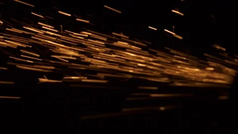 Yellow thin particles fly from right to left on black background Stock Footage 98480408