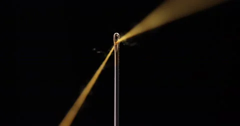 Yellow thread going through needle eye, closeup Stock-Footage 168364043