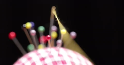 Yellow thread passing through the eye of the needle, close-up Stock Footage 168363934