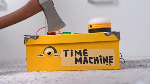 Yellow time machine box with axe and buttons on carpet 스톡 동영상 329534777