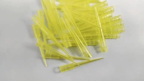 Yellow tip for micropipette . Stock Photos