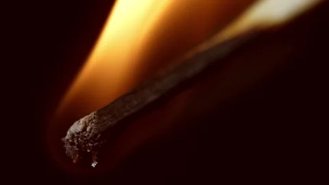 Yellow tipped match as a macro in shooting burning moment close up Stock Footage 317821379
