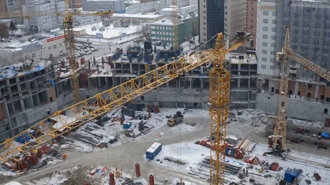 Yellow Tower Building Crane closeup on Unfinished Building Construction Site Stock Footage 98739815