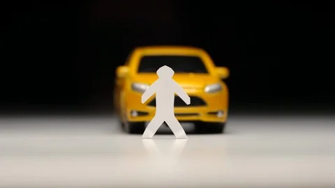 Yellow toy car knocks down a male figure - Slow motion Видео 93241259