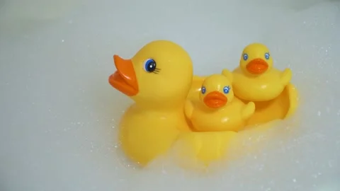 Yellow toy ducks in the bath Stock Footage 132276341