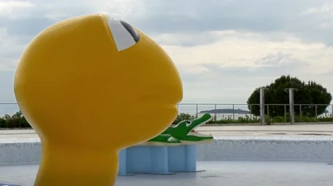 Yellow toy turtle in empty water park before season Stock Footage 68345669