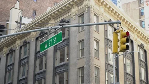 Yellow traffic lights at intersection in New York city. Red signal at w 27 st. Stock Footage 159977480